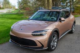 2024 Genesis GV60 in a fuchsia color.